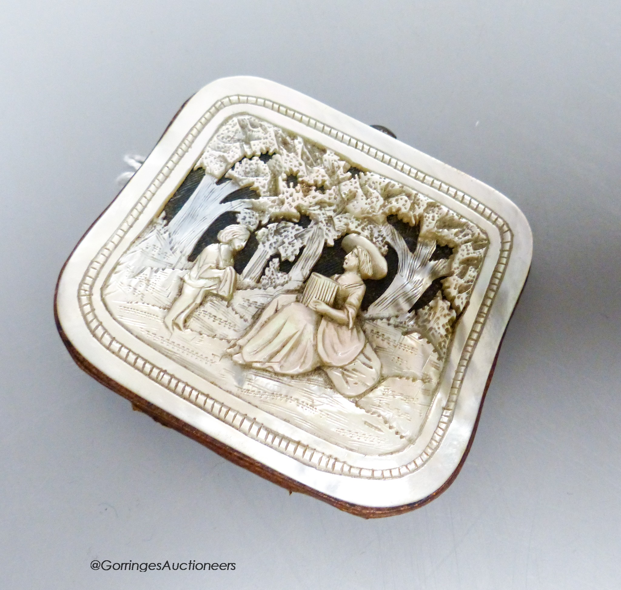 A 19th century carved mother of pearl purse, 6 x 7cm